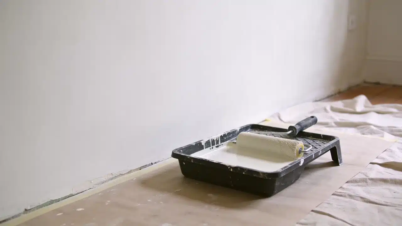 Preparing a limewashed wall before applying a new coat of paint